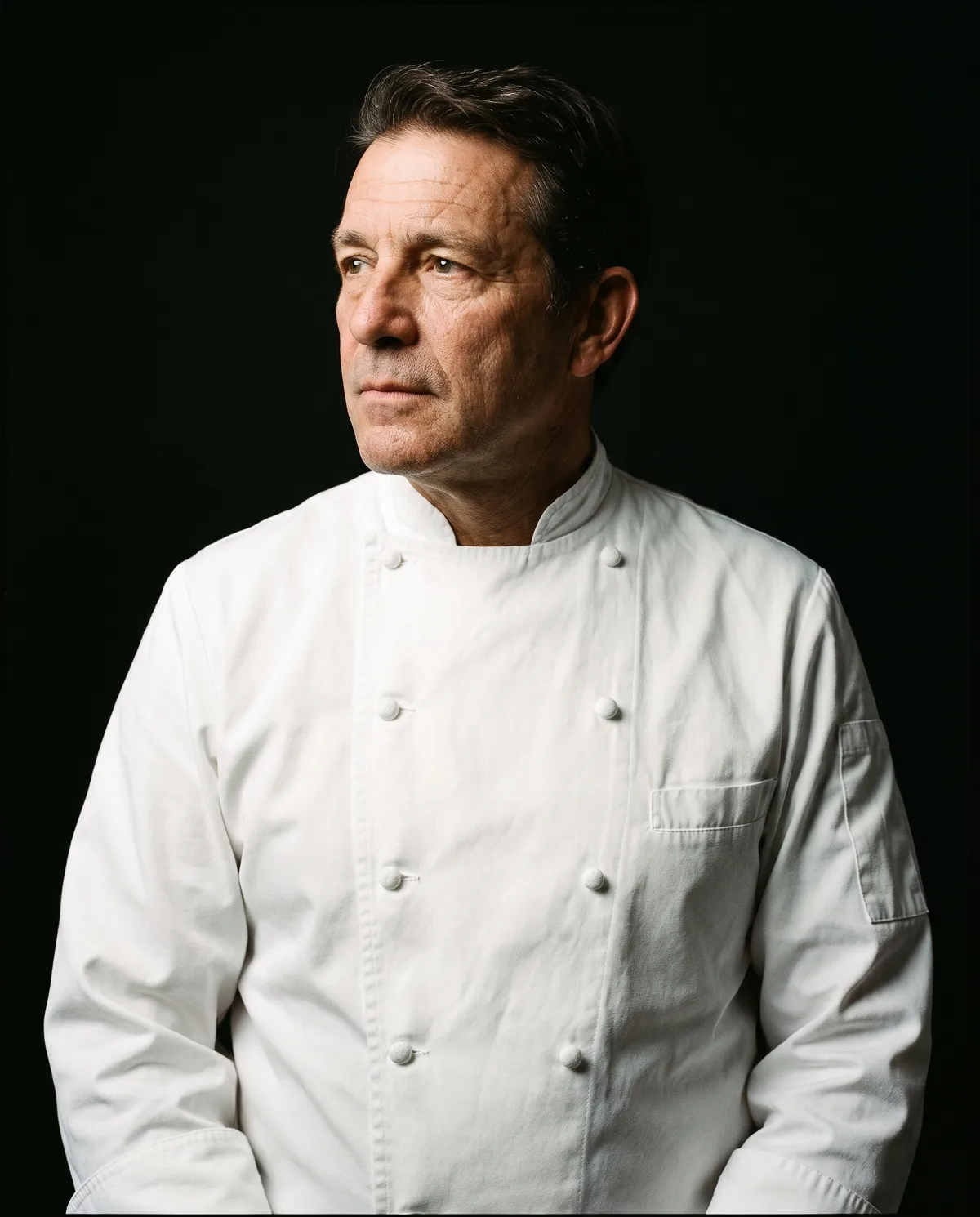 Portrait of Chef Julien Laveau in a white chef jacket